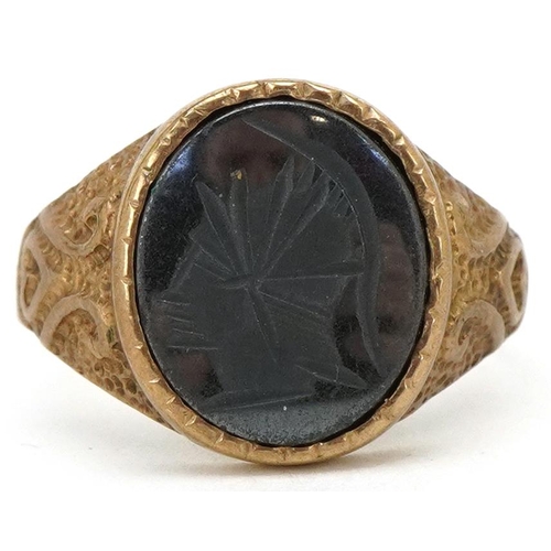 3225 - A 9ct gold intaglio seal ring carved with a gladiator head, with ornate shoulders, size S, 4.0g. (sh... 