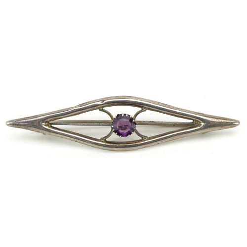 3124 - Edward Smith, an Arts & Crafts silver brooch set with a purple stone solitaire, Chester 1912, 6cm wi... 