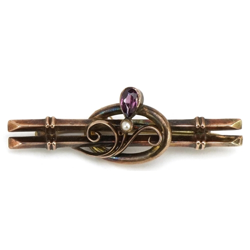 3112 - An Arts & Crafts style 9ct gold amethyst and seed pearl bar brooch, 4.5cm wide, 3.5g.