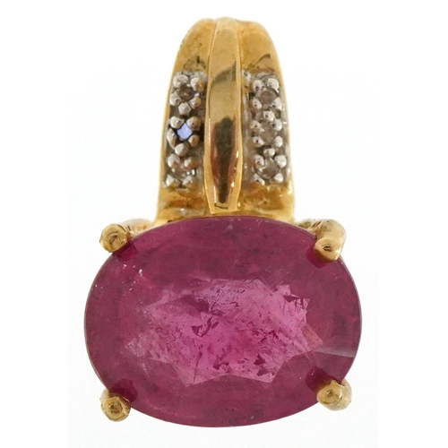 3199 - A 9ct gold ruby and diamond pendant, the ruby approximately 12.35mm x 9.45mm x 6.70mm deep, overall ... 