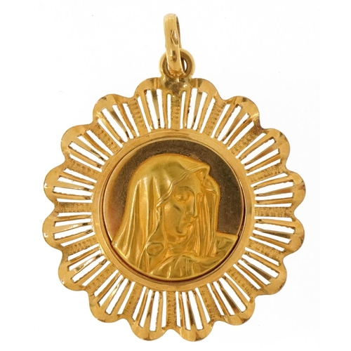 3013 - An 18ct gold religious interest pendant decorated with a Madonna, 3cm in diameter, 5.0g.