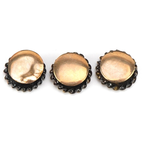 3201 - A set of three Victorian unmarked gold gentlemen's dress studs housed in a velvet and silk lined fit... 