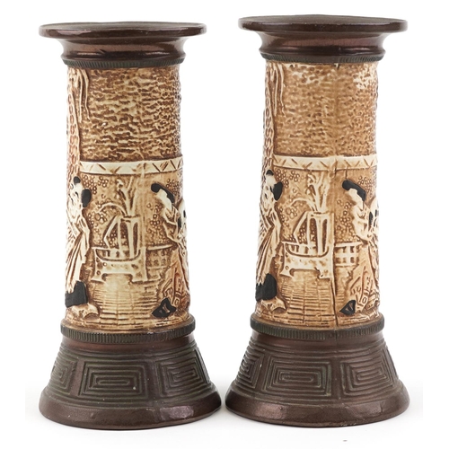 1165 - **WITHDRAWN** A pair of Bretby pottery vases relief decorated with Chinese figures, impressed 1839 t... 