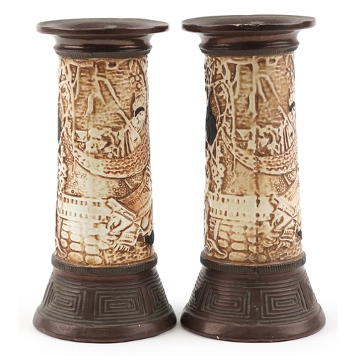 1165 - **WITHDRAWN** A pair of Bretby pottery vases relief decorated with Chinese figures, impressed 1839 t... 