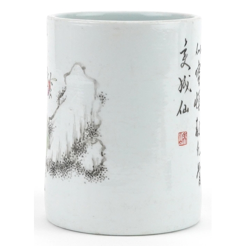 298 - A Chinese porcelain cylindrical brush pot hand painted with an elder with fruit before mountains and... 