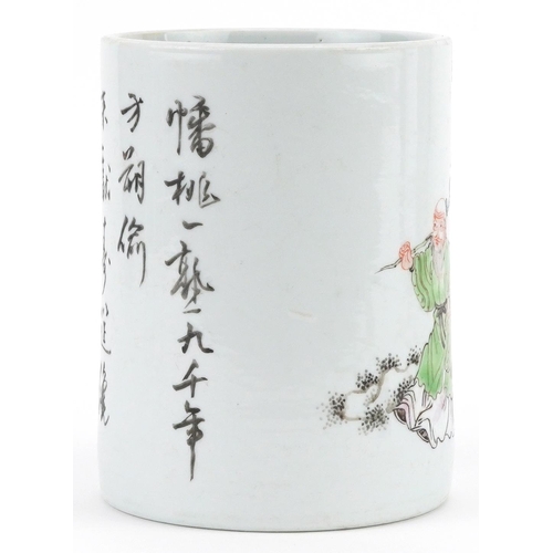 298 - A Chinese porcelain cylindrical brush pot hand painted with an elder with fruit before mountains and... 