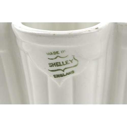 124 - An early 20th century Copeland creamware pottery jelly mould together with a similar Shelley jelly m... 