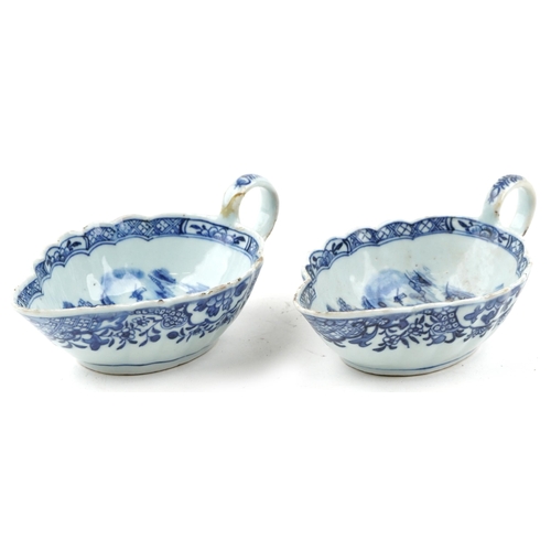 206 - A near pair of Chinese blue and white porcelain sauceboats, 18th century, each decorated with landsc... 