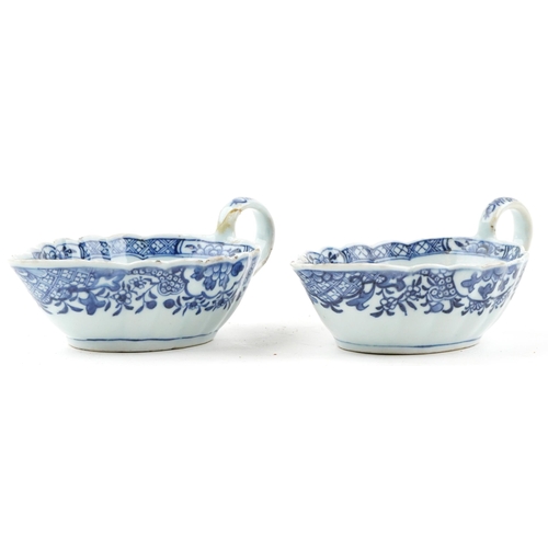 206 - A near pair of Chinese blue and white porcelain sauceboats, 18th century, each decorated with landsc... 