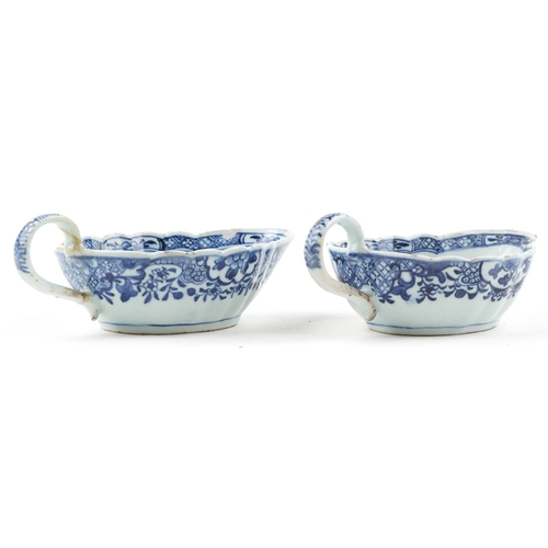 206 - A near pair of Chinese blue and white porcelain sauceboats, 18th century, each decorated with landsc... 