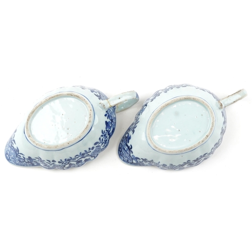 206 - A near pair of Chinese blue and white porcelain sauceboats, 18th century, each decorated with landsc... 