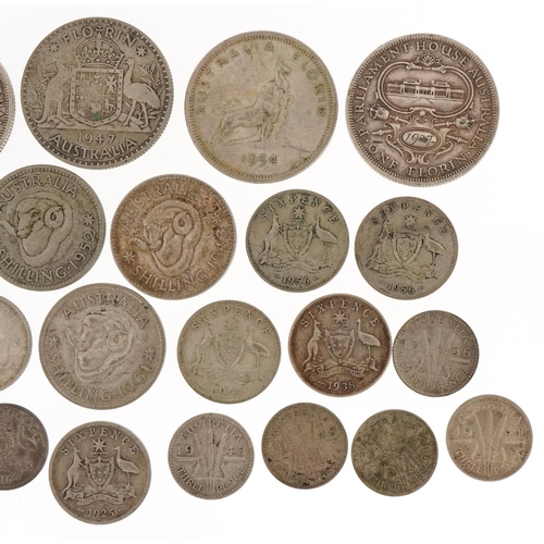 2184 - A George V Australian silver and white metal coins to include Parliament House Australia 1927 one fl... 