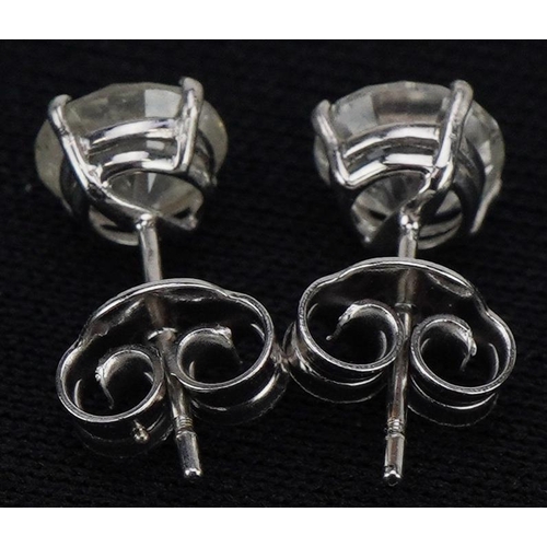 3005 - A pair of 18ct white gold diamond solitaire earrings, total diamond weight approximately 1.7carat