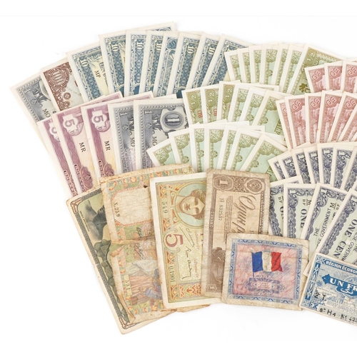 2215 - A quantity of vintage world banknotes to include Japanese Occupational Governmental banknotes of Mal... 