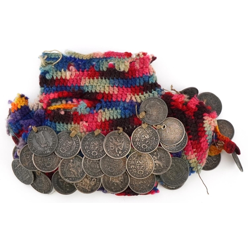 2207 - A mid 19th century Peruvian hand crocheted miser's purse with approximately fifty drilled silver coi... 