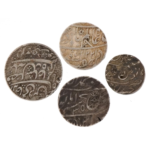 2202 - Four early 19th century Indian silver coins to include one rupee and half rupee, the largest coin 27... 