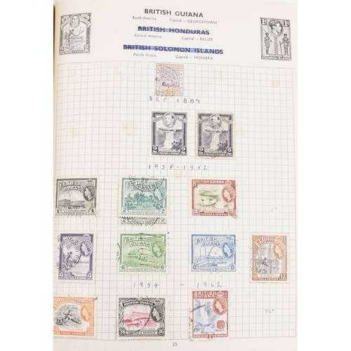 2220A - Two blue stamp albums containing 19th century and later British and world stamps.