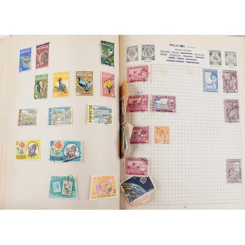 2220A - Two blue stamp albums containing 19th century and later British and world stamps.