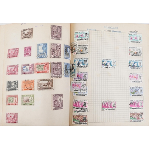 2220A - Two blue stamp albums containing 19th century and later British and world stamps.