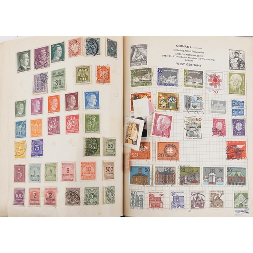 2220A - Two blue stamp albums containing 19th century and later British and world stamps.