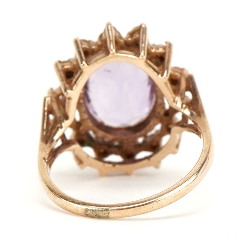 3221 - A 9ct gold amethyst and seed pearl ring, size M, 4.4g.