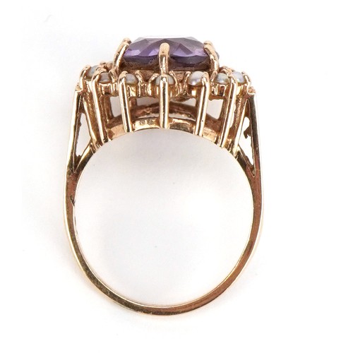 3221 - A 9ct gold amethyst and seed pearl ring, size M, 4.4g.