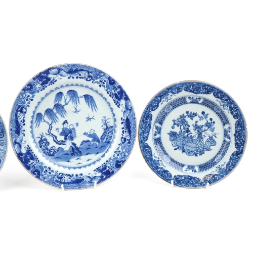 250 - A group of four Chinese blue and white porcelain circular plates, 18th century, with hand painted de... 