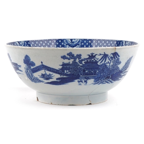 117 - A 19th century English porcelain blue and white transfer printed Willow pattern bowl, 24cm in diamet... 