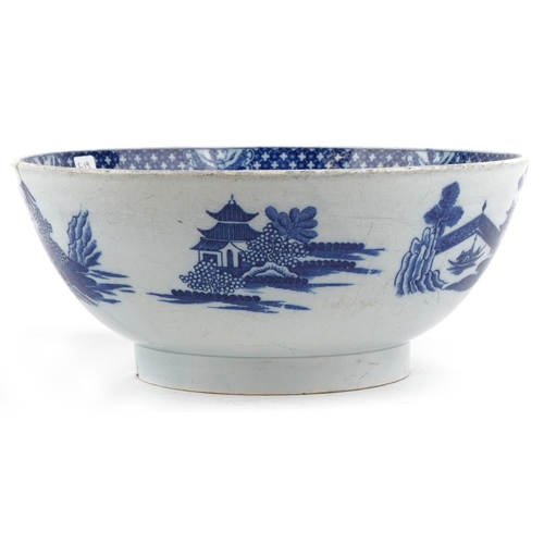 117 - A 19th century English porcelain blue and white transfer printed Willow pattern bowl, 24cm in diamet... 