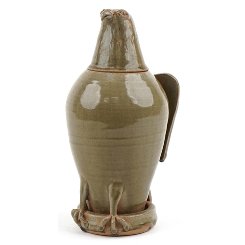 315 - A Chinese celadon glazed stoneware jar and cover in the form of an eagle, 33cm high.