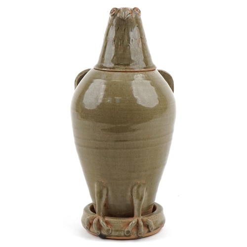 315 - A Chinese celadon glazed stoneware jar and cover in the form of an eagle, 33cm high.