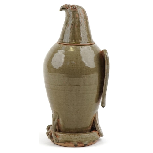 315 - A Chinese celadon glazed stoneware jar and cover in the form of an eagle, 33cm high.