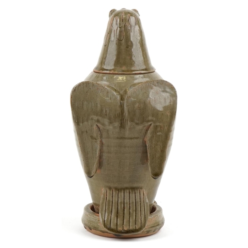 315 - A Chinese celadon glazed stoneware jar and cover in the form of an eagle, 33cm high.