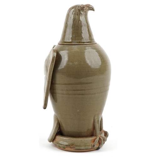 315 - A Chinese celadon glazed stoneware jar and cover in the form of an eagle, 33cm high.