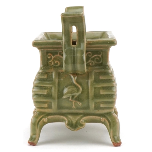 220 - A Chinese porcelain celadon glazed incense burner with twin handles, 16cm high x 18cm wide.