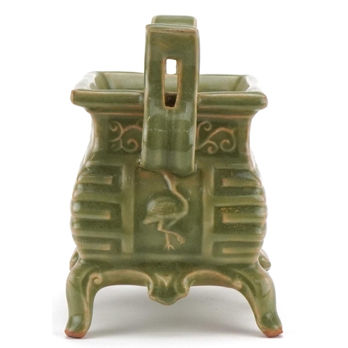 220 - A Chinese porcelain celadon glazed incense burner with twin handles, 16cm high x 18cm wide.