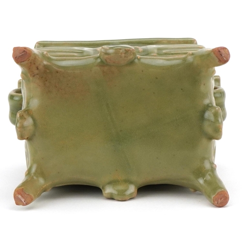 220 - A Chinese porcelain celadon glazed incense burner with twin handles, 16cm high x 18cm wide.