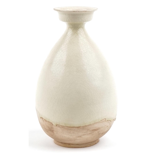 534 - A Chinese cream glazed pottery vase, 26cm high.