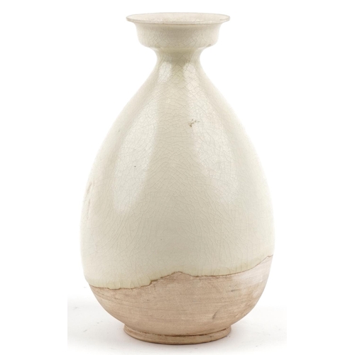 534 - A Chinese cream glazed pottery vase, 26cm high.