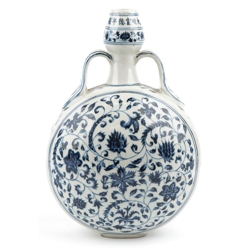 150 - A Chinese porcelain blue and white twin handled moon flask hand painted with foliage and vines, 32cm... 