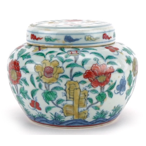 317 - A Chinese porcelain jar and cover hand painted with butterflies amongst flowers, six figure characte... 