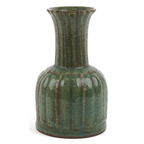 495 - A Chinese porcelain vase having a green crackle glaze, 22cm high.