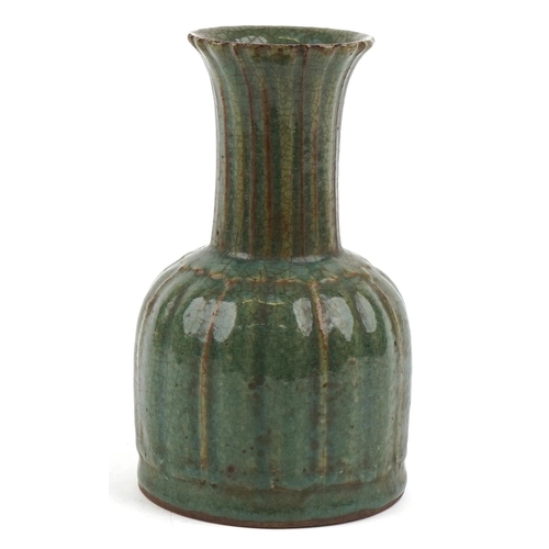 495 - A Chinese porcelain vase having a green crackle glaze, 22cm high.