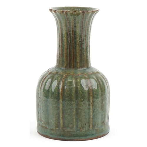 495 - A Chinese porcelain vase having a green crackle glaze, 22cm high.