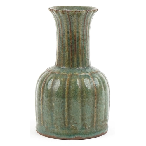 495 - A Chinese porcelain vase having a green crackle glaze, 22cm high.