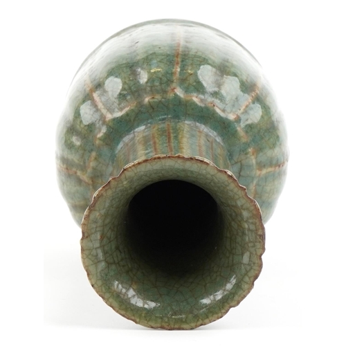 495 - A Chinese porcelain vase having a green crackle glaze, 22cm high.