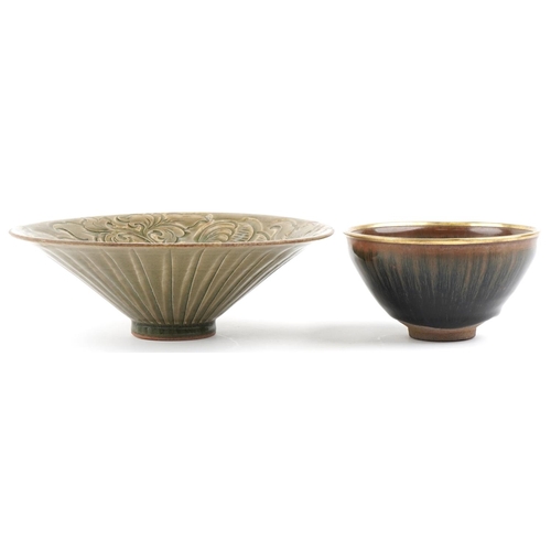 468 - Two Chinese pottery footed bowls, the larger with incised foliate decoration and 21cm in diameter.