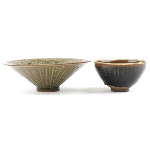 468 - Two Chinese pottery footed bowls, the larger with incised foliate decoration and 21cm in diameter.