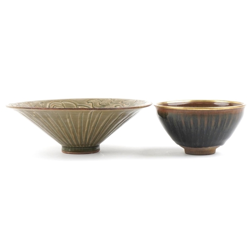 468 - Two Chinese pottery footed bowls, the larger with incised foliate decoration and 21cm in diameter.