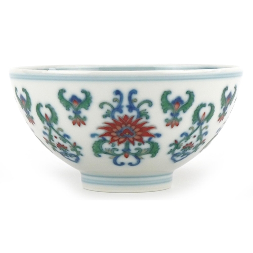 187 - A 20th century Chinese porcelain footed bowl hand painted with stylized flowers, six figure characte... 